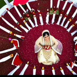 **A vibrant aerial shot of a Pakistani wedding (Shadi) being filmed by a drone.** (Focus on the cultural aspects of a Pakistani wedding captured from a drone's perspective)